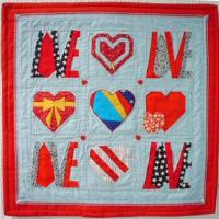 Marti Freedman sewed this heartly wall hanging and also added the Love lettering from Yvonne Nielson. Pay attention, the pattern shows the mirrored lettering.   www.yvonnes.dk/love2003.htm 